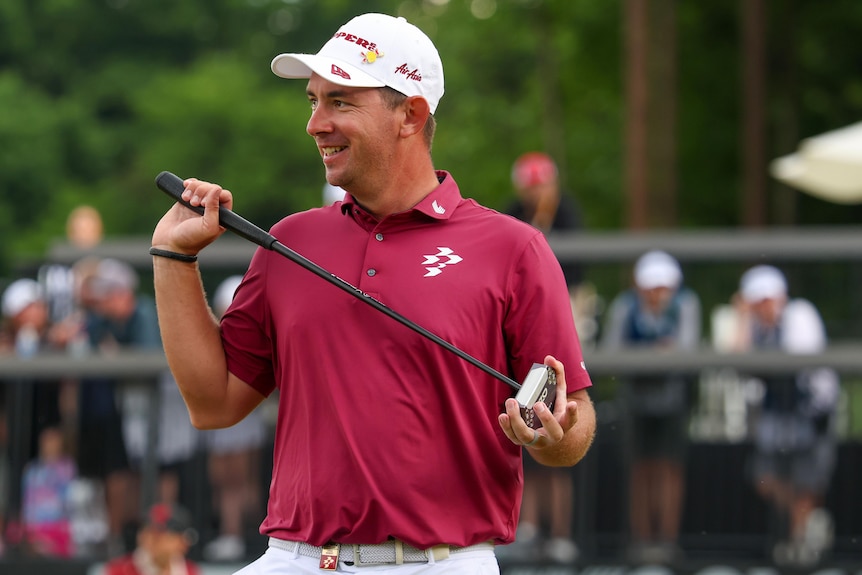Lucas Herbert holds his putter