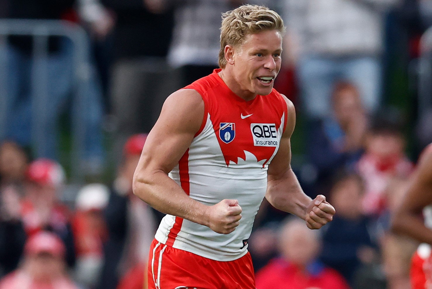 Isaac Henney cleebrates a Swans goal.