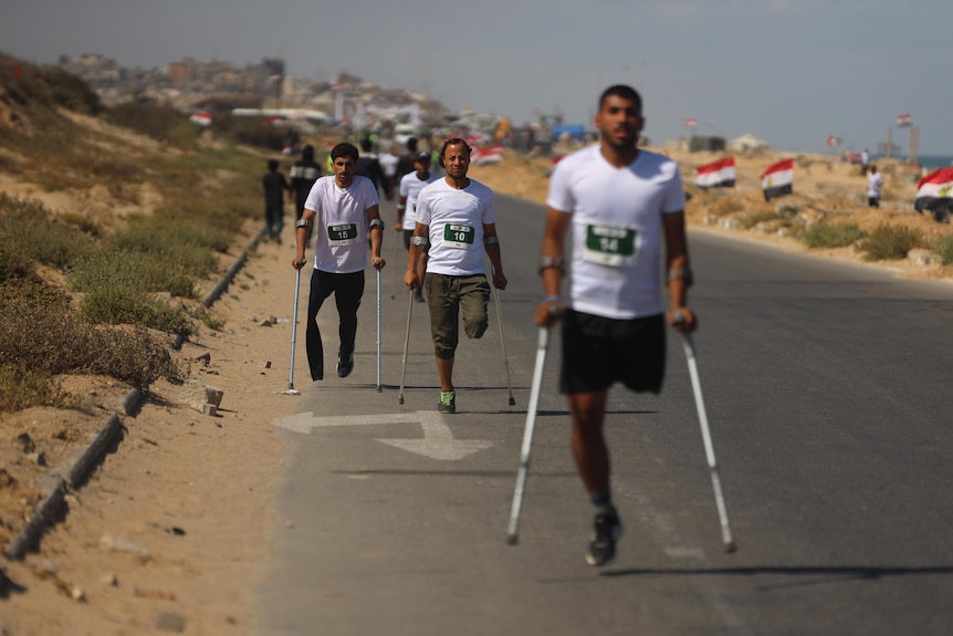 Para-runners run along a road