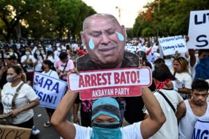 Philippine justice chief orders arrest of senator wanted by ICC