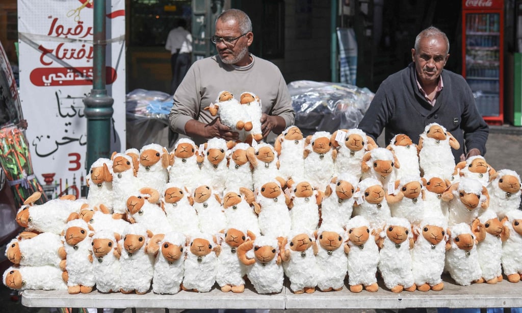 A vendor displays stuffed sheep toys outside his shop on the eve of the Eid al-Adha in the Israeli-occupied West Bank city of Nablus on Tuesday. Photo: AFP