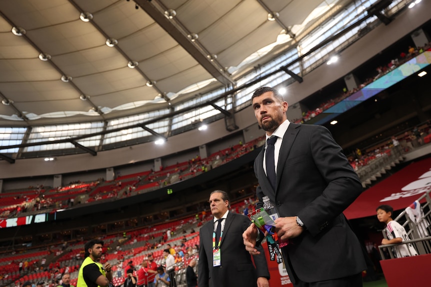 Socceroos goalkeeper Mat Ryan walks out of the tunnel before a FIFA World Cup game.