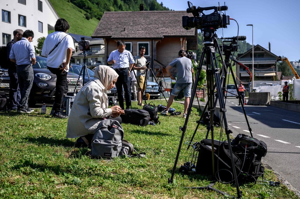 Journalists set up near an access to the Burgenstock luxury hotel complex above Lake Lucerne on Friday, where talks following up on a deal to end the Middle East conflict were scheduled to begin. Photo: AFP Journalists set up near an access to the Burgenstock luxury hotel complex above Lake Lucerne on Friday, where talks following up on a deal to end the Middle East conflict were scheduled to begin. Photo: AFP