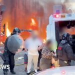 Watch: Residents flee as cars and houses burn in Belfast