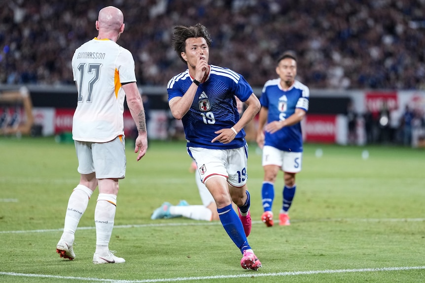 Koki Ogawa celebrates a goal
