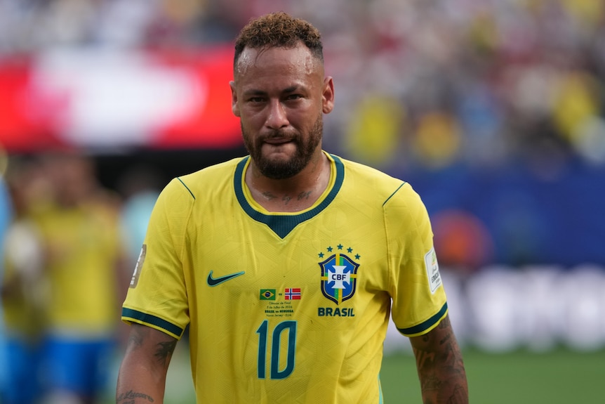 Brazil player Neymar walks off disappointed after a loss