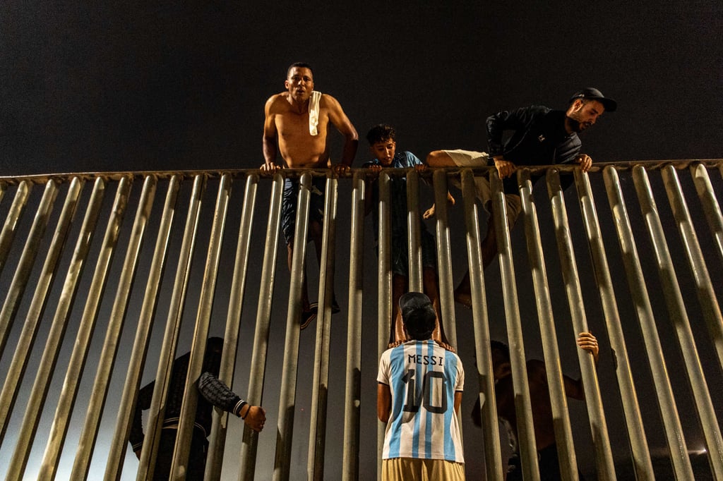 Migrants try to cross from Morocco into the Spanish enclave of Ceuta on Friday. Photo: AP Migrants try to cross from Morocco into the Spanish enclave of Ceuta on Friday. Photo: AP