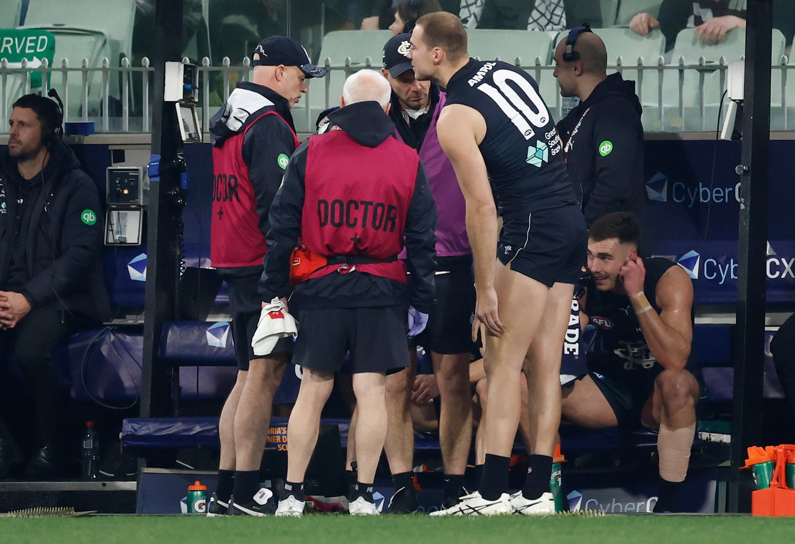 Harry McKay of the Blues is seen with medical staff during the 2026 AFL Round 19 match between the Collingwood Magpies and the Carlton Blues at the Melbourne Cricket Ground on July 18, 2026 in Melbourne, Australia.