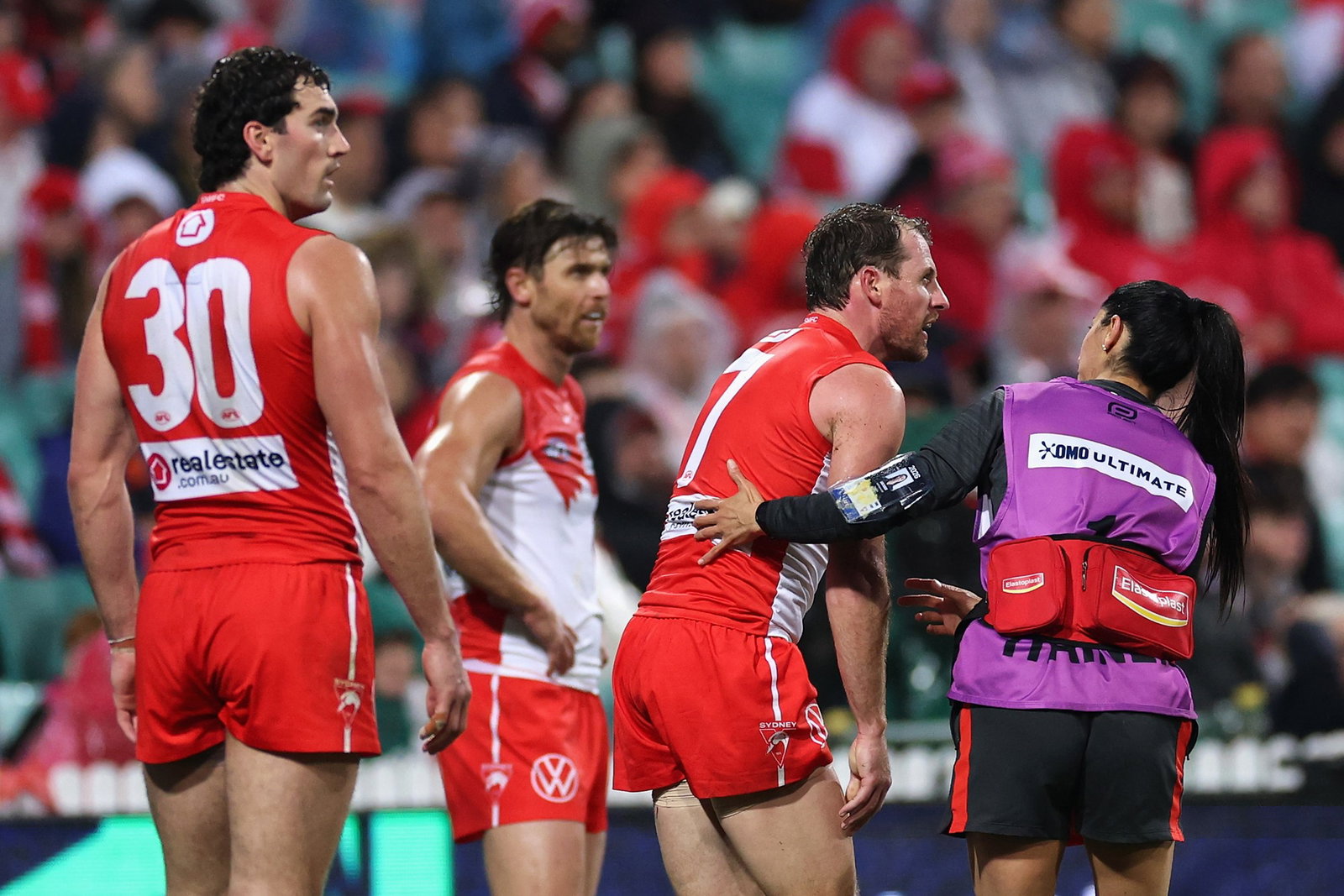 Harry Cunningham of the Swans leaves the field injured during the round 19 AFL match between Sydney Swans and Adelaide Crows at Sydney Cricket Ground, on July 17, 2026, in Sydney, Australia.