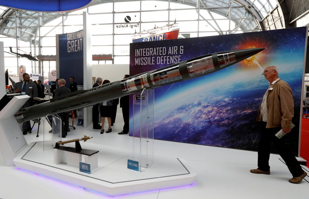 A man looks at a Patriot Advanced Capability (PAC-3) Missile Segment Enhancement model by Lockheed Martin at an international military fair in Kielce, Poland, in September 2017. Photo: Reuters