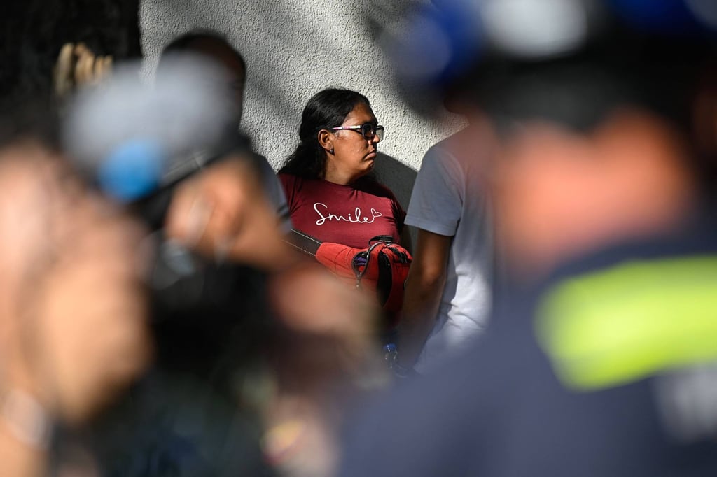 Hernan Gil’s wife, Gusbimar Gonzalez, is seen among rescuers before he was pulled out from the rubble in Catia La Mar on Thursday. Photo: AFP Hernan Gil’s wife, Gusbimar Gonzalez, is seen among rescuers before he was pulled out from the rubble in Catia La Mar on Thursday. Photo: AFP