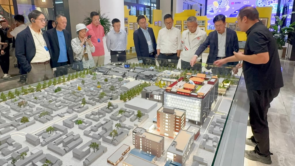 Lawmakers are briefed on work in the Longfu Temple Historical and Cultural District. Photo: Handout Lawmakers are briefed on work in the Longfu Temple Historical and Cultural District. Photo: Handout