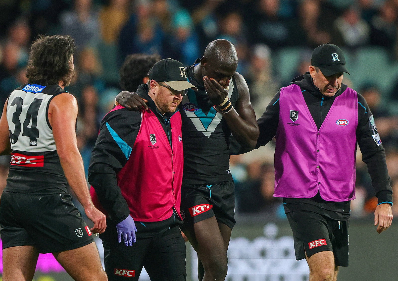 Port defender Aliir Aliir was left concussed from Jacob van Rooyen's swinging arm.