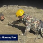 Nepal floods: rescuers send air pipe into tunnel with trapped workers