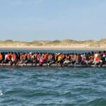Record 230 people cross Channel in one small boat