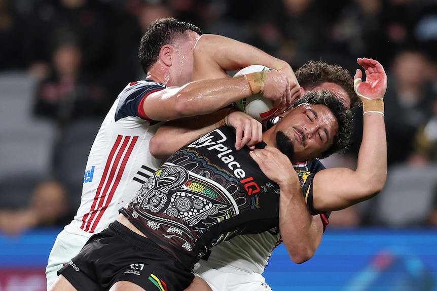 A man is tackled during a rugby league match 