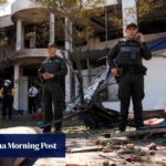 Truck explodes outside Colombia police base, injuring 11 officers and killing a dog
