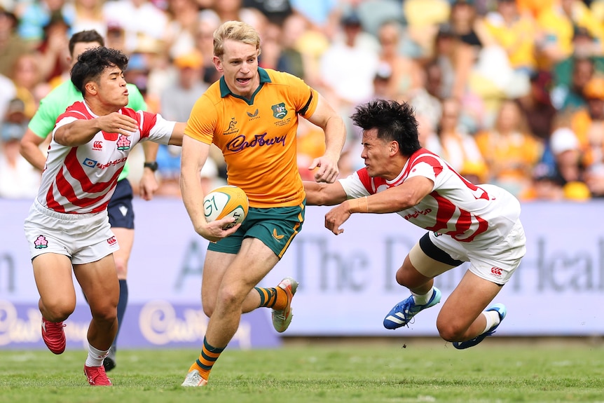 Max Jorgensen of the Wallabies makes a break, running with the rugby ball