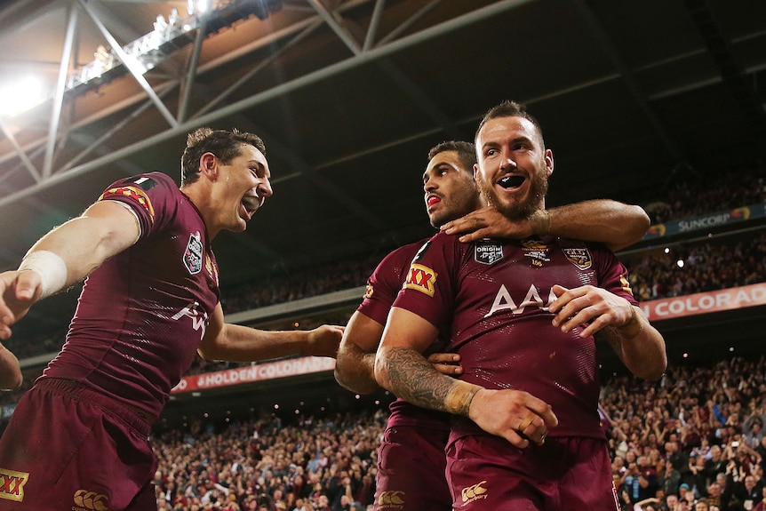 Billy Slater, Darius Boyd and Greg Inglis celebrate a try
