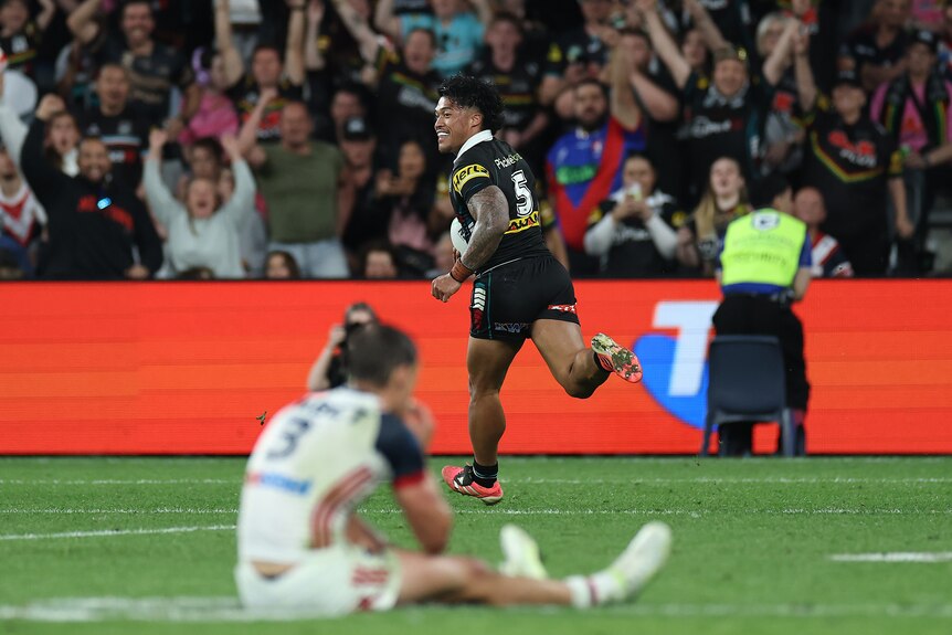 A man runs away to score an intercept try in an NRL match