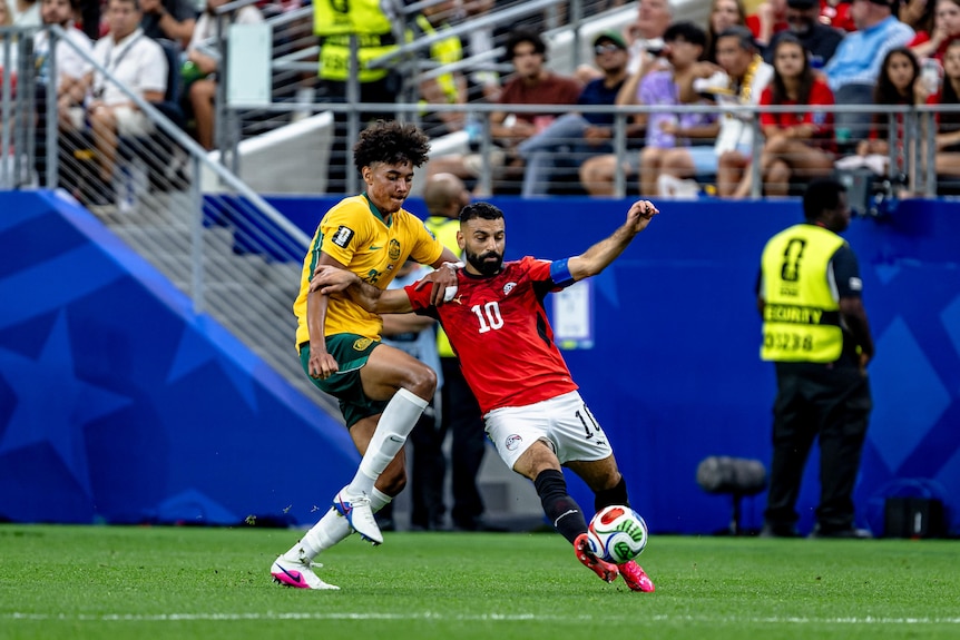 Lucas Herrington of Australia and Mohamed Salah of Egypt