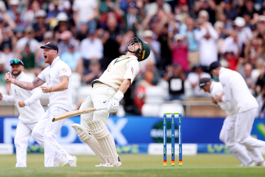 Marnus Labuschagne throws his head back in disappointment as English fielders celebrate