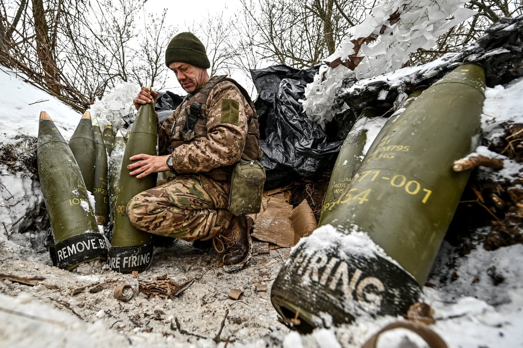 A Ukrainian serviceman prepares 155mm artillery shells at a position near the front line in the Zaporizhzhia region, Ukraine, in January 2024. Photo: Reuters