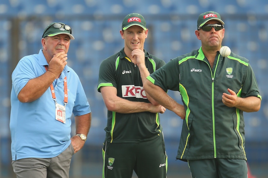 Australia selector Rod Marsh, captain George Bailey and coach Darren Lehmann stand together at cricket training.
