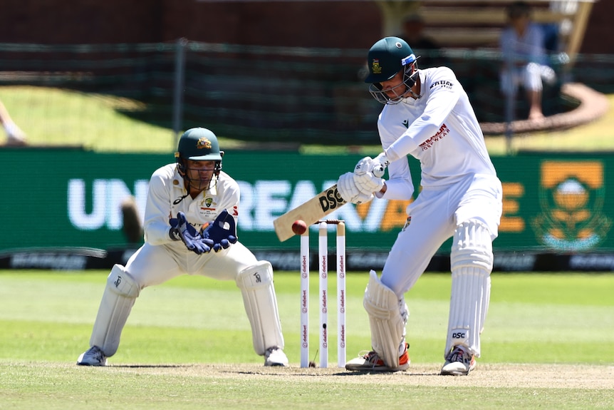 Marco Jansen plays a cut shot as Alex Carey watches from behind the stumps