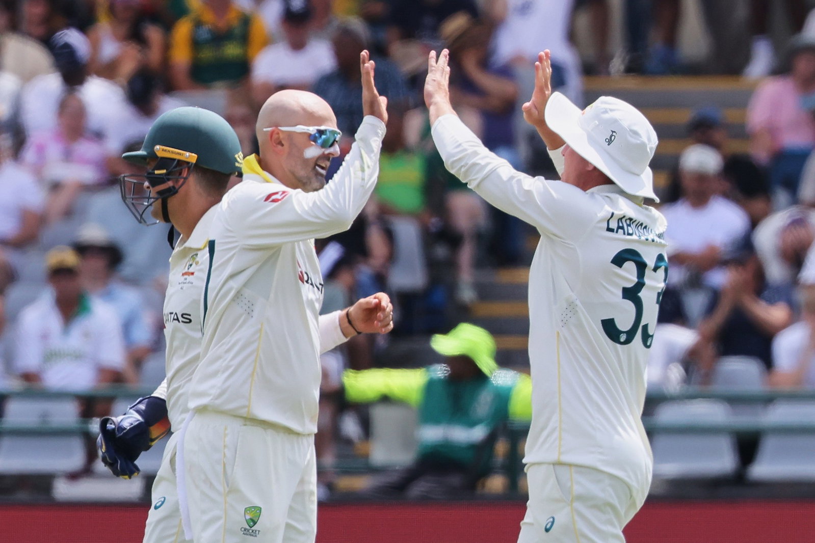 Nathan Lyon (left) removed Temba Bavuma five minutes out from stumps to put Australia firmly in control in Cape Town.