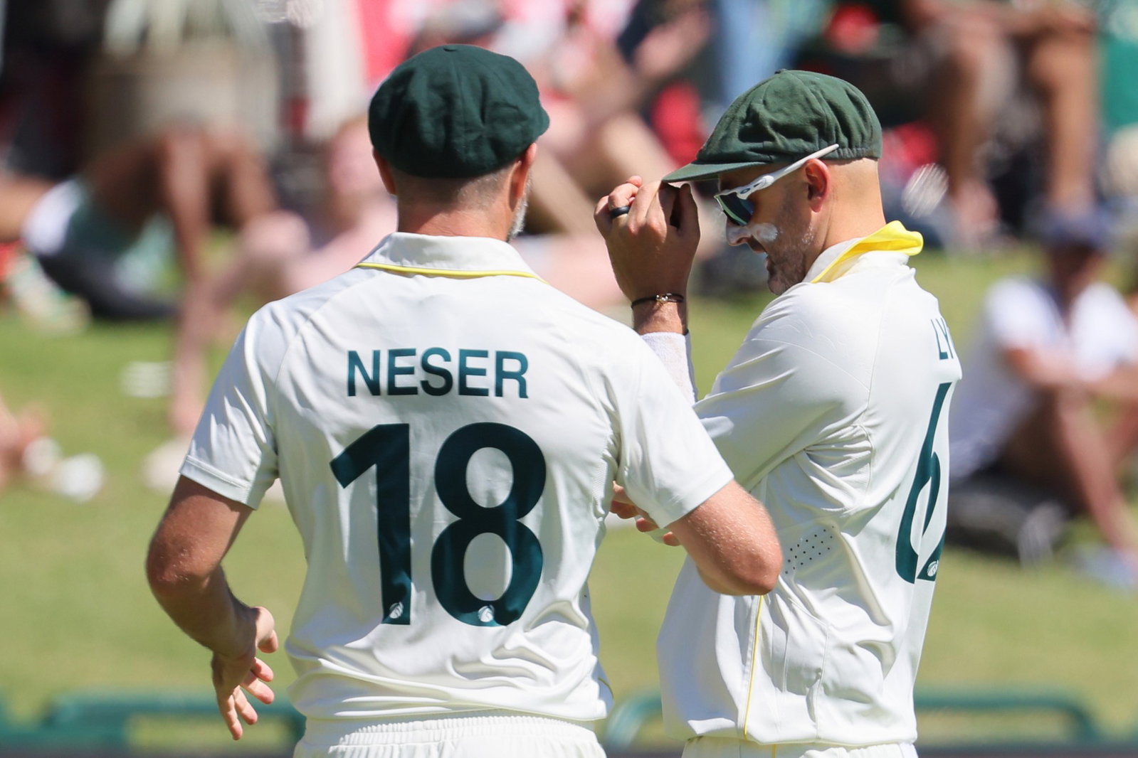 Nathan Lyon (right) reacts after taking the catch to dismiss David Bedingham in the deep.