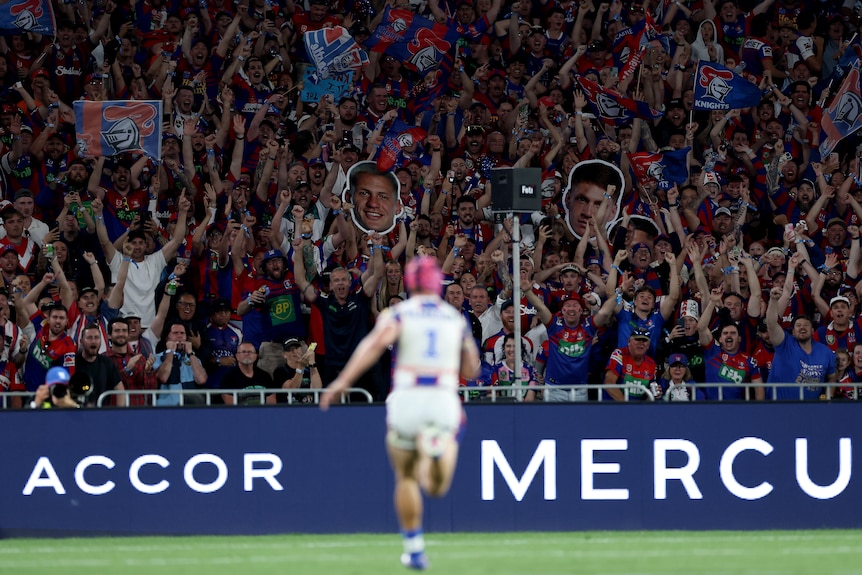 Kalyn Ponga runs towards Newcastle Knights fans as he scores a try in the NRL grand final.
