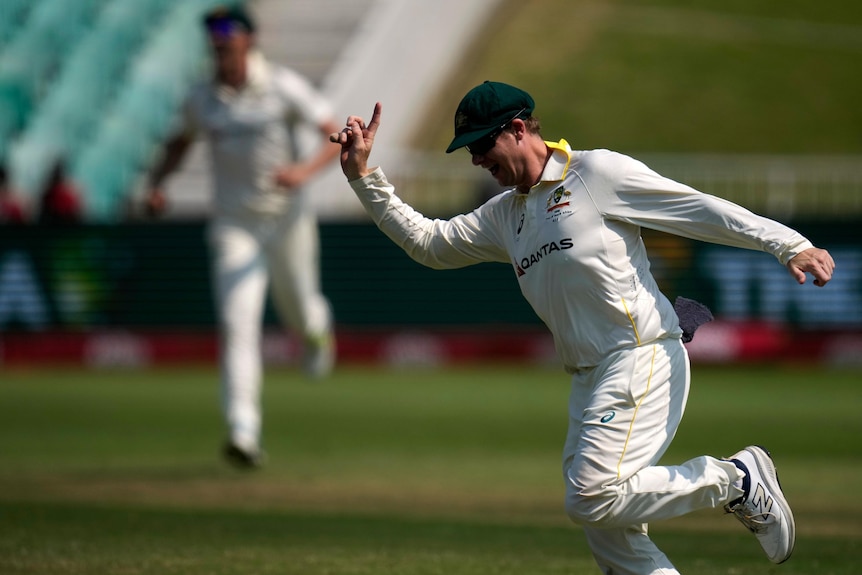 Steve Smith puts a finger in the air to celebrate a catch in a Test against South Africa.