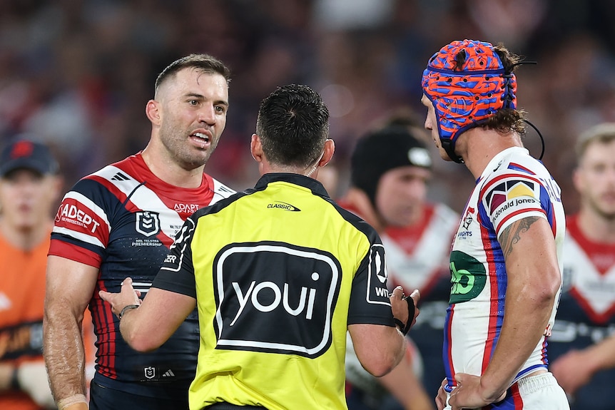 Referee talks to pair of captains during an NRL grand final