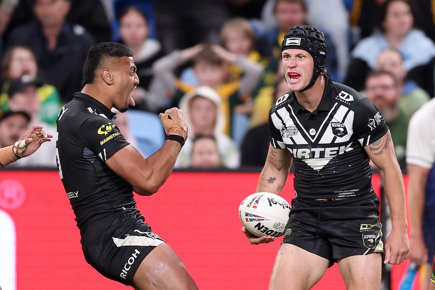 Kiwis player Kalyn Ponga has a ferocious smile as he celebrates scoring a try