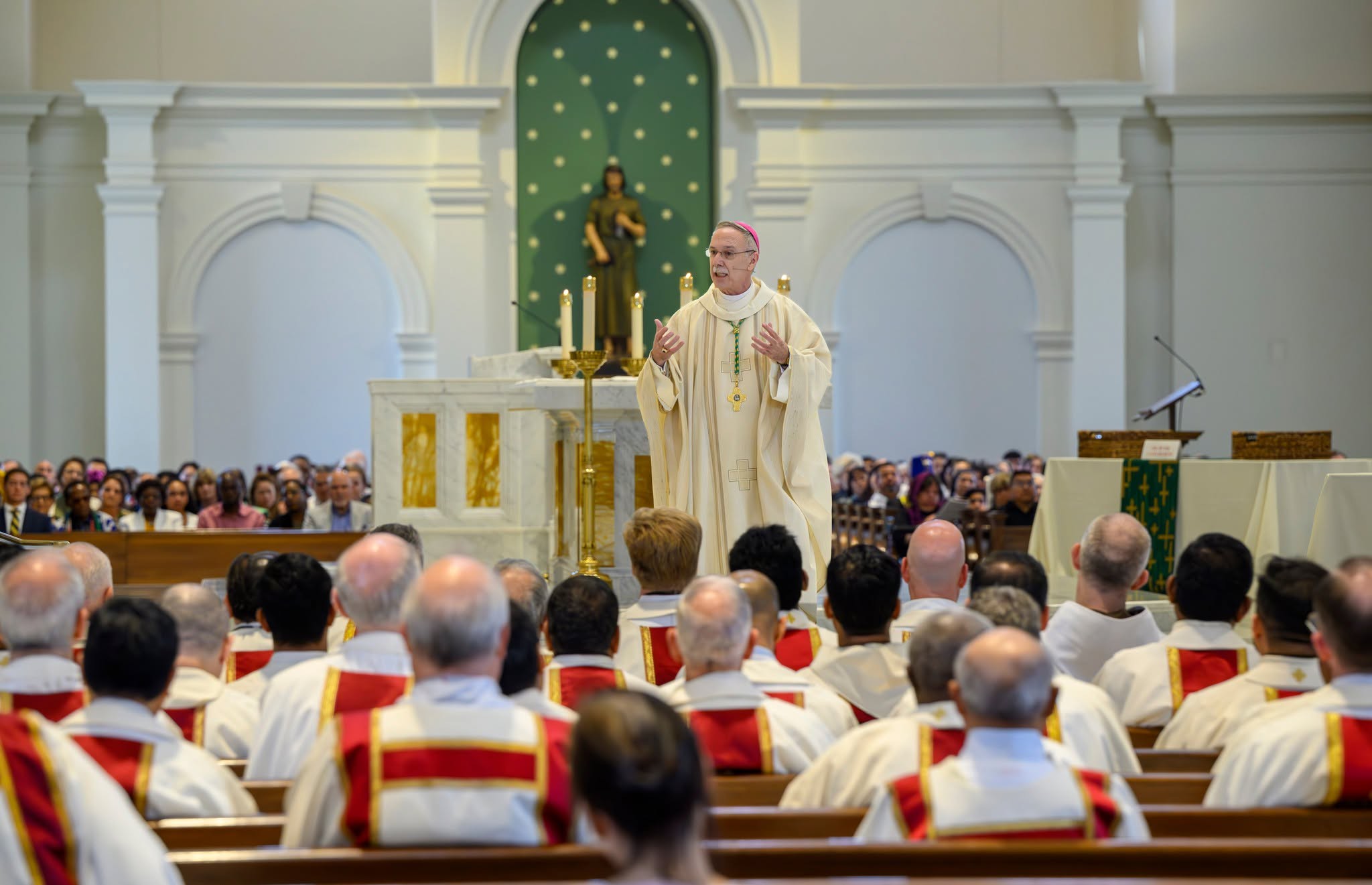 Bishop Luis Rafael Zarama addresses clergy and the congregation in a photo used as the cover image on the Diocese of Raleigh’s Facebook page