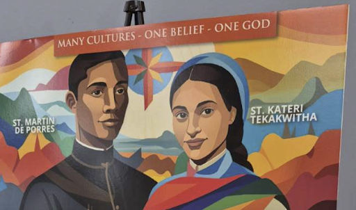 Diocese poster pairing St. Martin de Porres and St. Kateri Tekakwitha under the banner “Many Cultures — One Belief — One God.”