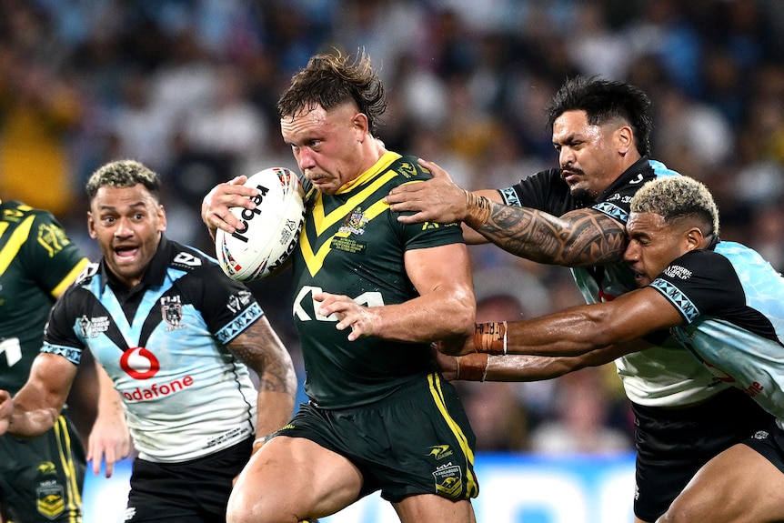 Reuben Cotter runs with the ball during a World Cup match.